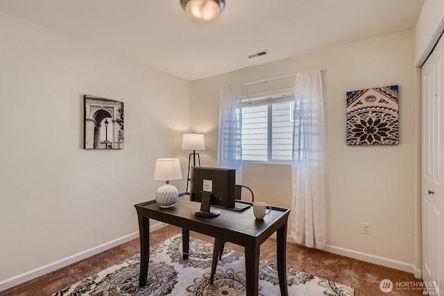 office with carpet floors, visible vents, and baseboards