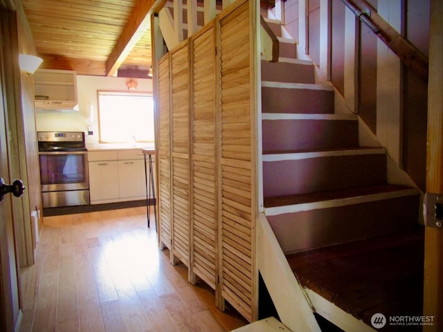 845 Schmid Rd, Grayland, WA 98547 - stairs featuring wood finished floors, wooden ceiling, and beamed ceiling
