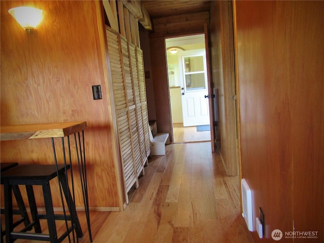 845 Schmid Rd, Grayland, WA 98547 - corridor with light wood-style floors and wooden walls