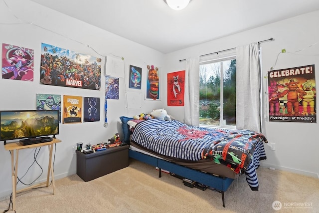 carpeted bedroom featuring baseboards