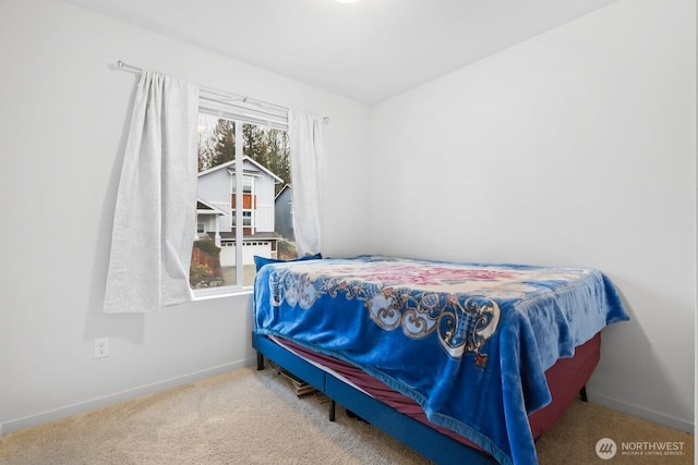 carpeted bedroom with baseboards