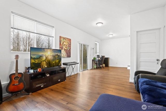 living room with wood finished floors and baseboards