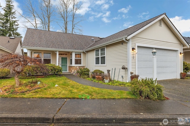 single story home with a garage, stone siding, aphalt driveway, roof with shingles, and a front yard