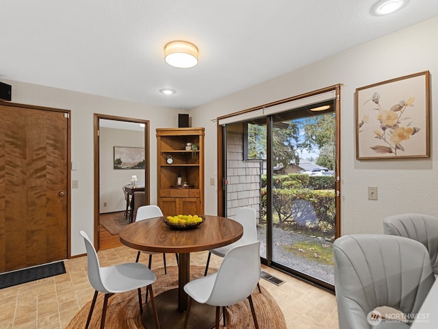 dining space featuring visible vents