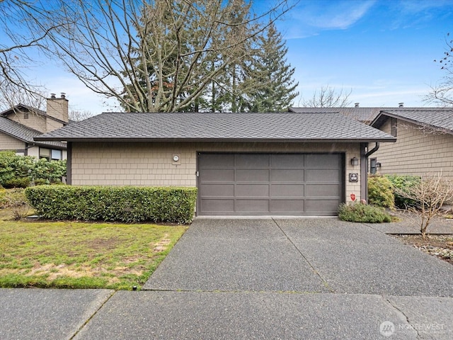 garage featuring concrete driveway