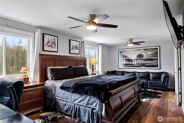 bedroom featuring a ceiling fan and dark wood-type flooring