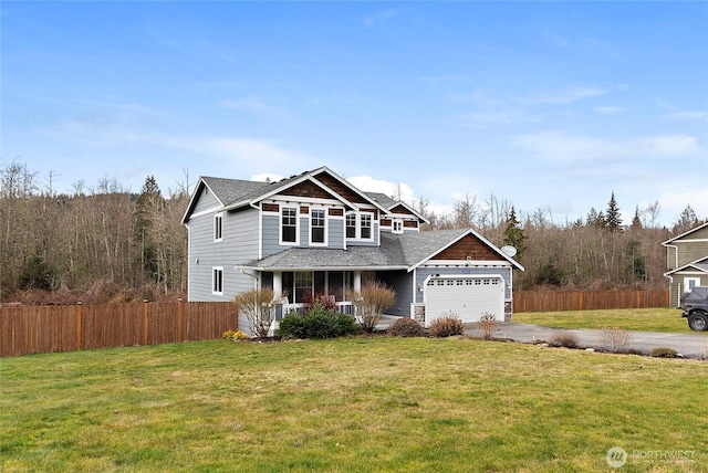 view of front facade featuring driveway, covered porch, a garage, and fence