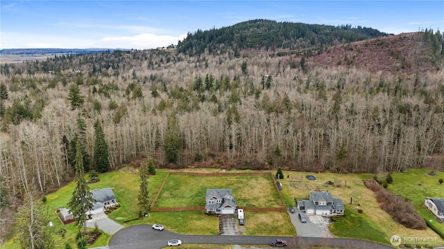 bird's eye view with a mountain view and a wooded view