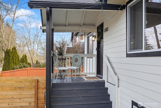 exterior space featuring fence and a deck