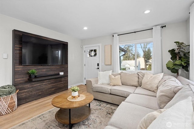 living room featuring wood finished floors and recessed lighting