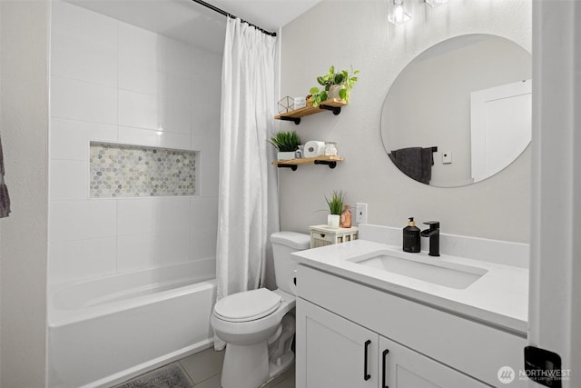 full bathroom with tile patterned floors, vanity, toilet, and shower / bath combo with shower curtain