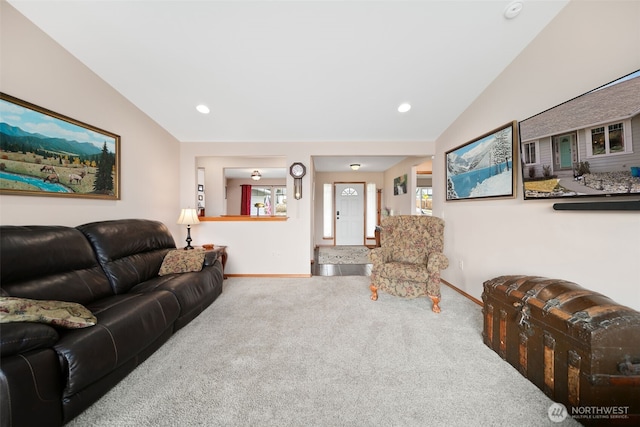 carpeted living room featuring lofted ceiling, baseboards, and recessed lighting