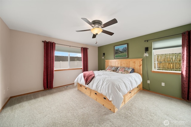 bedroom featuring carpet flooring, ceiling fan, visible vents, and baseboards