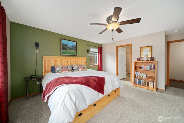 bedroom with carpet, baseboards, and a ceiling fan