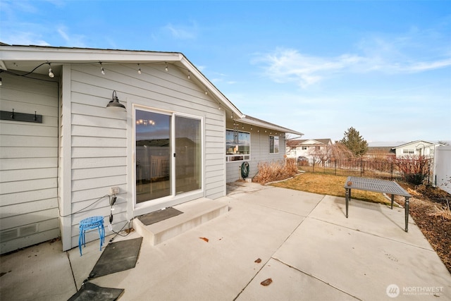 view of patio / terrace featuring entry steps and fence