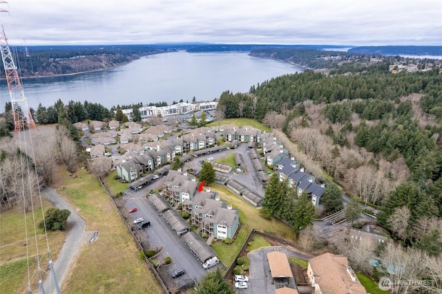 drone / aerial view with a residential view and a water view