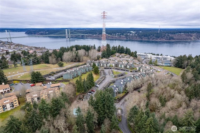 birds eye view of property with a water view and a residential view