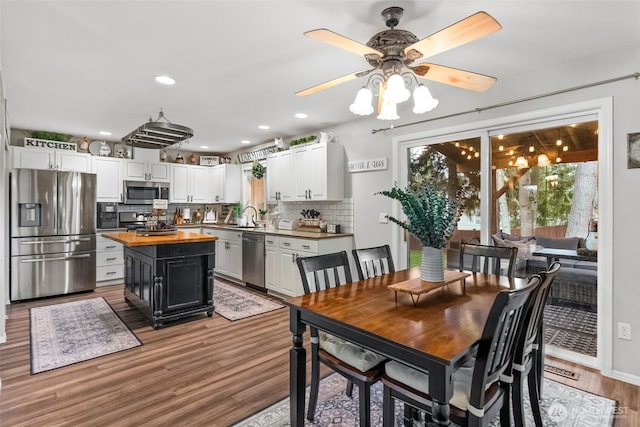 dining area featuring ceiling fan, wood finished floors, and recessed lighting