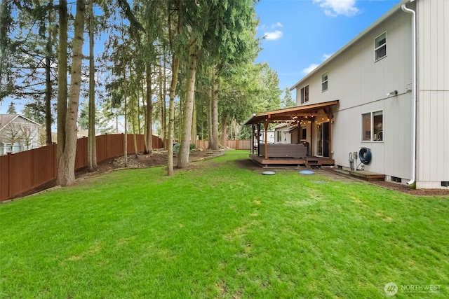 view of yard with a fenced backyard and a wooden deck