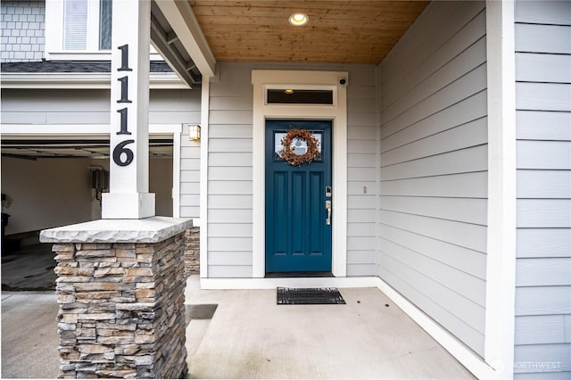 doorway to property featuring a garage