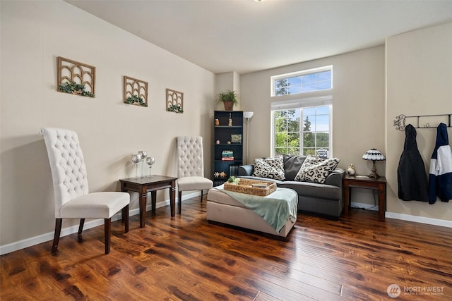 living area featuring dark wood-style floors and baseboards