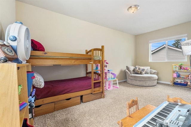 carpeted bedroom featuring baseboards