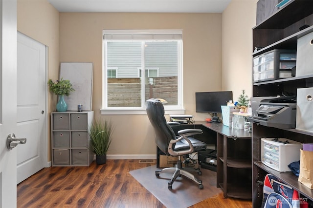 office with wood finished floors, visible vents, and baseboards