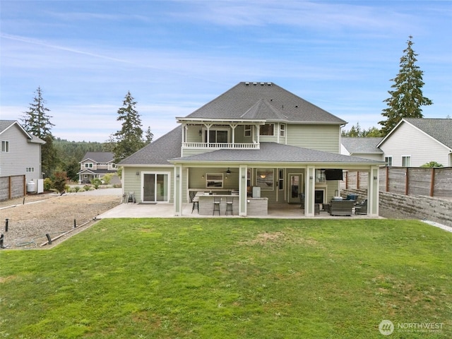 rear view of house with a patio, ceiling fan, an outdoor hangout area, fence, and a yard