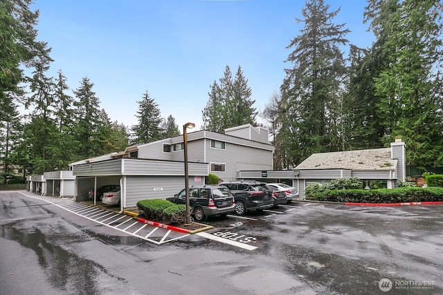 view of partially covered parking lot