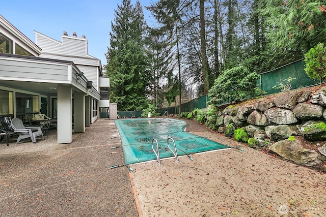 view of swimming pool with a fenced in pool, a patio area, and a fenced backyard