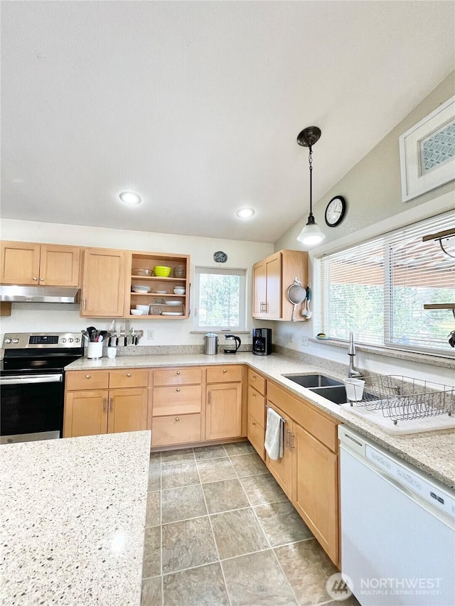 kitchen featuring white dishwasher, under cabinet range hood, a sink, stainless steel range with electric cooktop, and pendant lighting