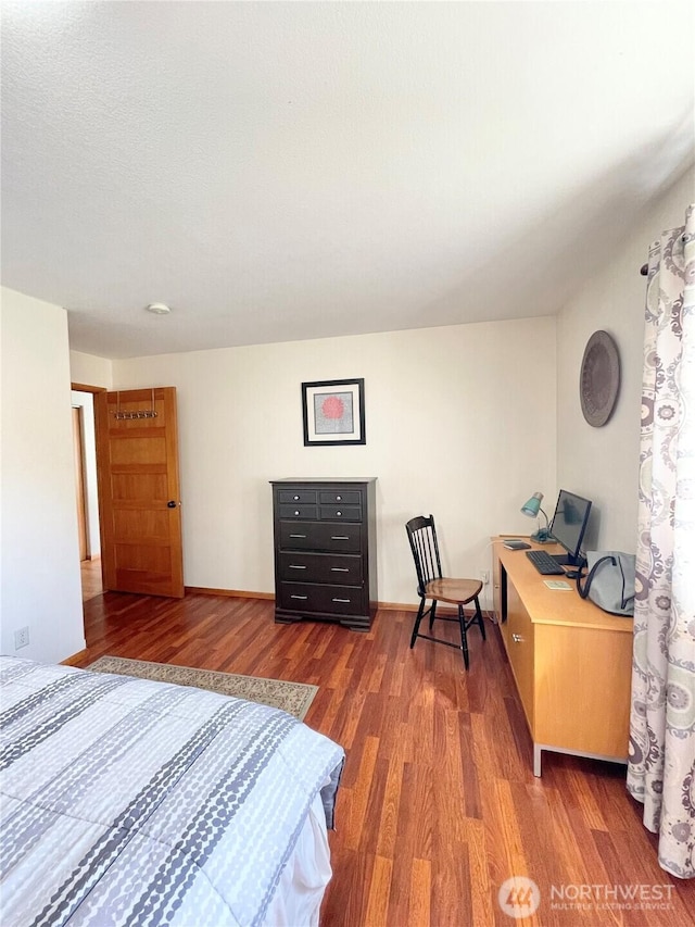 bedroom with wood finished floors