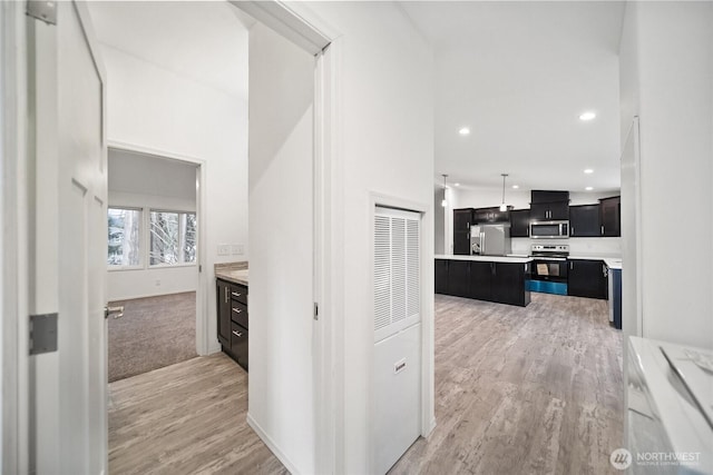 interior space with light wood finished floors and recessed lighting