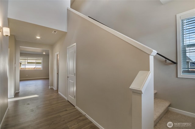 hall with stairway, baseboards, and dark wood finished floors