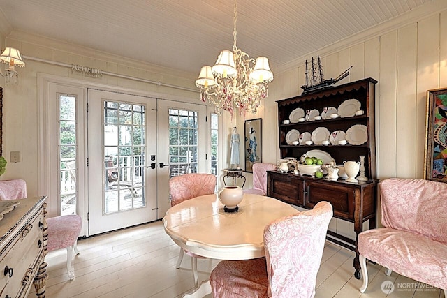 34800 J Pl, Ocean Park, WA 98640 - dining room featuring french doors, ornamental molding, a wealth of natural light, and an inviting chandelier