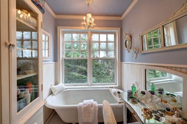 34800 J Pl, Ocean Park, WA 98640 - interior space with a soaking tub, ornamental molding, a notable chandelier, and wainscoting