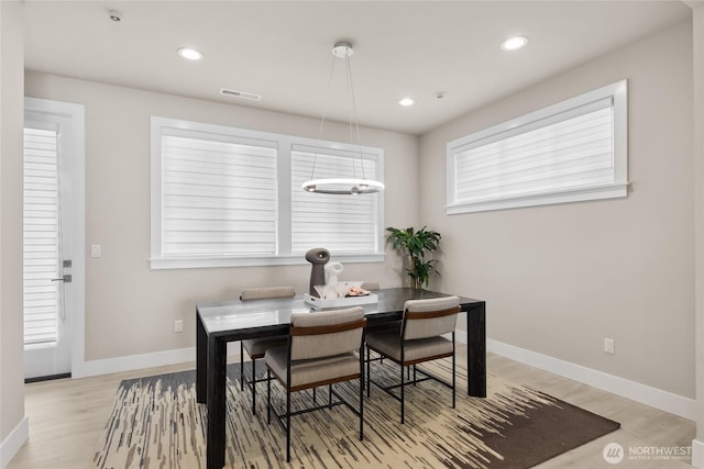 dining room with visible vents, recessed lighting, light wood-style flooring, and baseboards