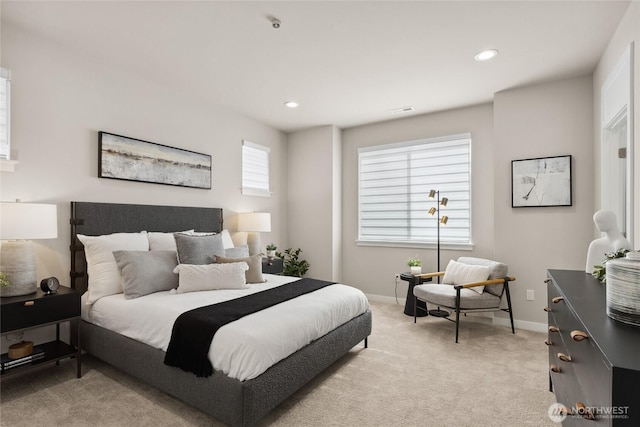 bedroom with baseboards, recessed lighting, visible vents, and light colored carpet