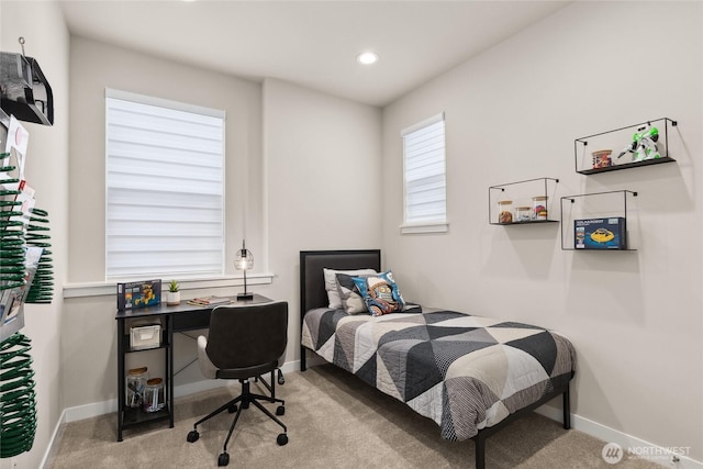 bedroom featuring recessed lighting, light colored carpet, and baseboards