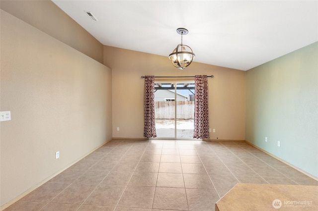 empty room featuring light tile patterned flooring, visible vents, baseboards, vaulted ceiling, and an inviting chandelier