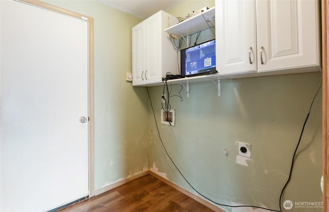 washroom featuring cabinet space, washer hookup, electric dryer hookup, and wood finished floors