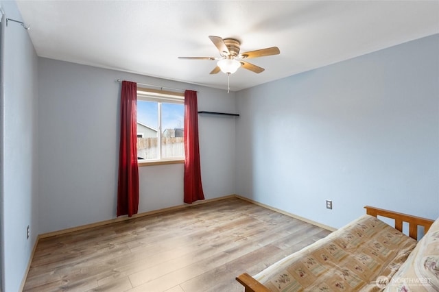 unfurnished room with ceiling fan and light wood finished floors