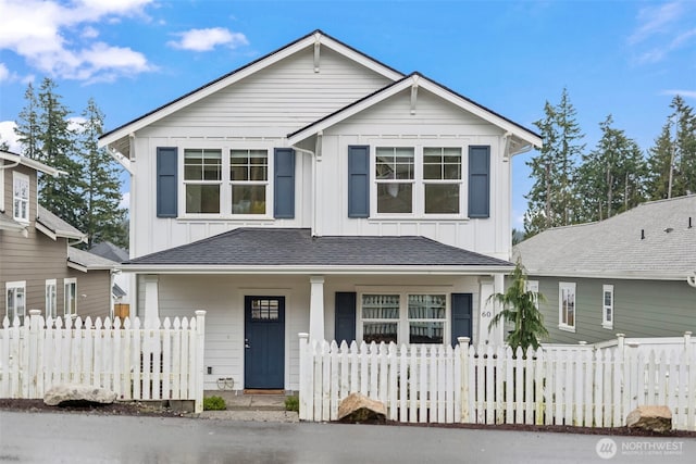 view of front of property with a fenced front yard and board and batten siding