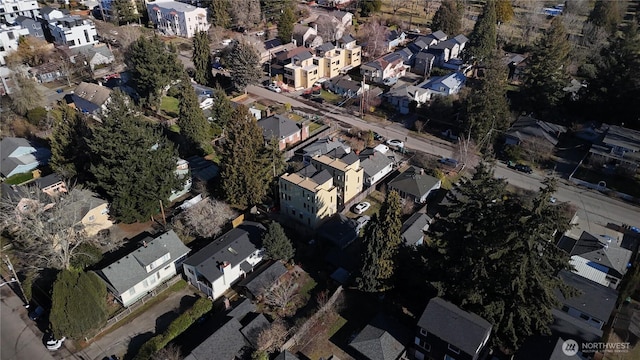 birds eye view of property with a residential view