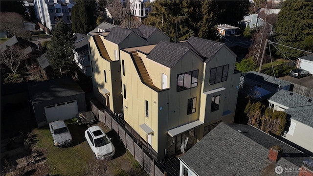 birds eye view of property with a residential view