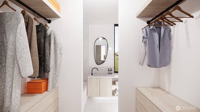 walk in closet featuring a sink