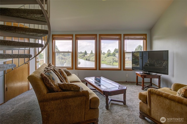 living room featuring carpet and lofted ceiling