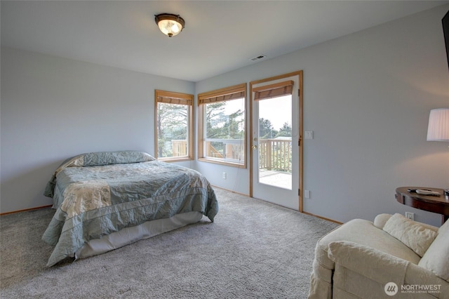 carpeted bedroom with access to exterior, baseboards, and visible vents