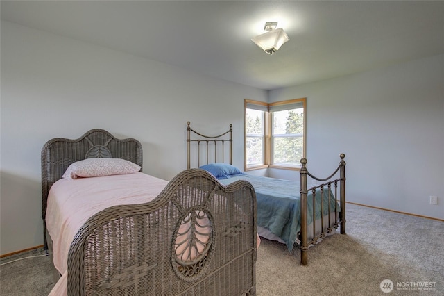 carpeted bedroom featuring baseboards