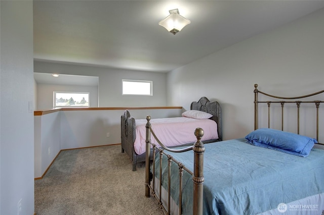 carpeted bedroom with baseboards